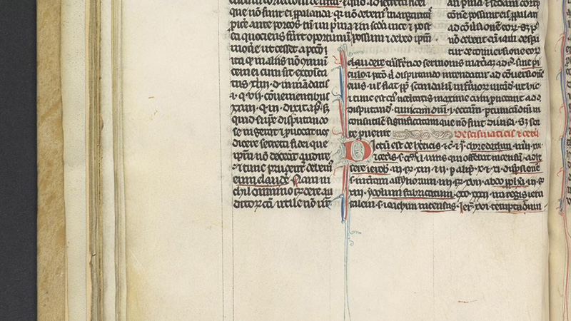 Portion of manuscript page with compact Latin script highlighted with red and blue decoration
