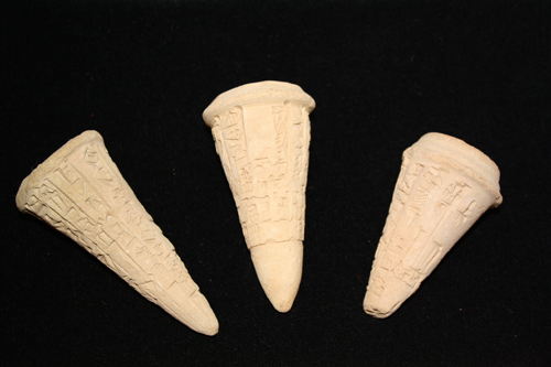 Three votive clay cones inscribed with cuneiform script. Uruk, Utuhegal (reigned in Uruk before 2112 B.C.E.). These cones would have been placed in the walls or foundations of buildings built during Utuhegel's time or commissioned by him directly.