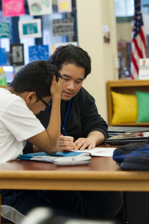 Teen Leadership assistants help younger students with homework.