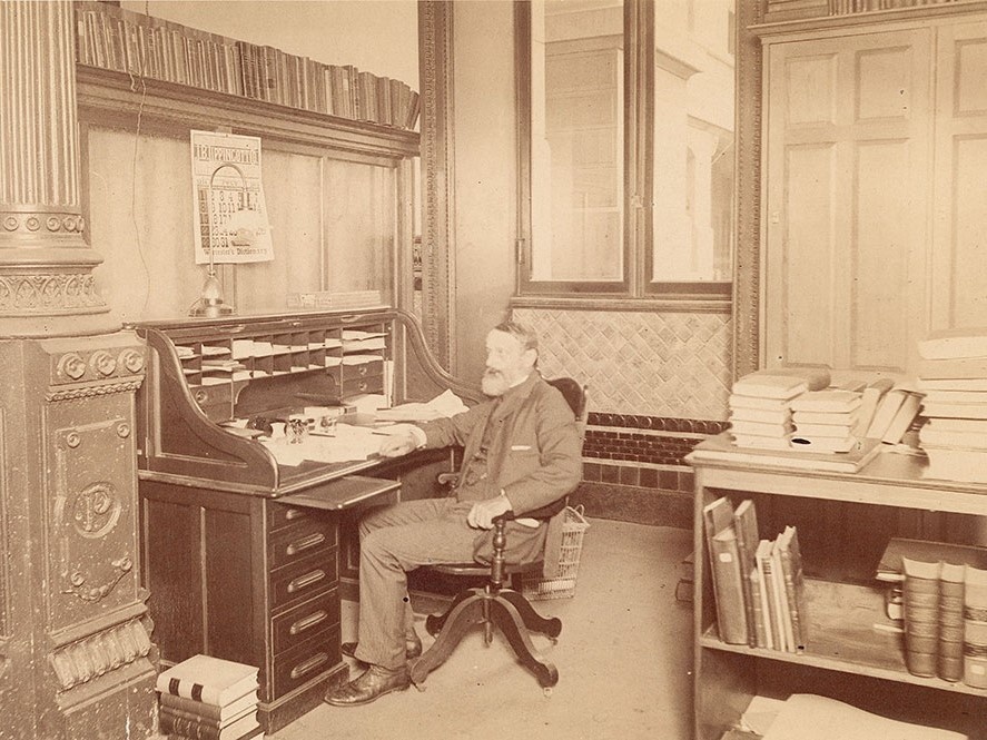 Librarian John Thomson at his desk in Free Library of Philadelphia at City Hall, 1894. [Photographic Prints]. Retrieved from the History of the Free Library of Philadelphia Archive.