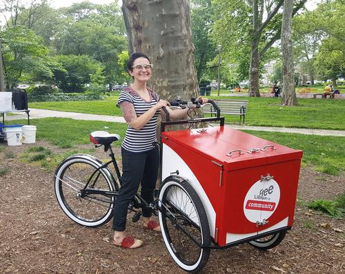 Children’s Librarian Link Ross rides over to Clark Park in West Philly with the brand new Book Bike