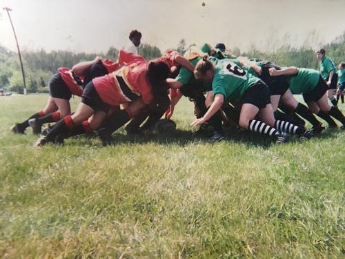 A rugby scrum (in which the author—whose hand can be seen next to the ball—is 'putting in' the ball to initiate play)