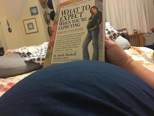 The author with a copy of What to Expect When You’re Expecting