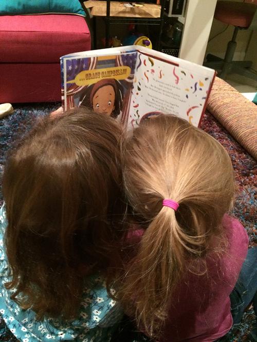 The author's daughters reading Grace for President