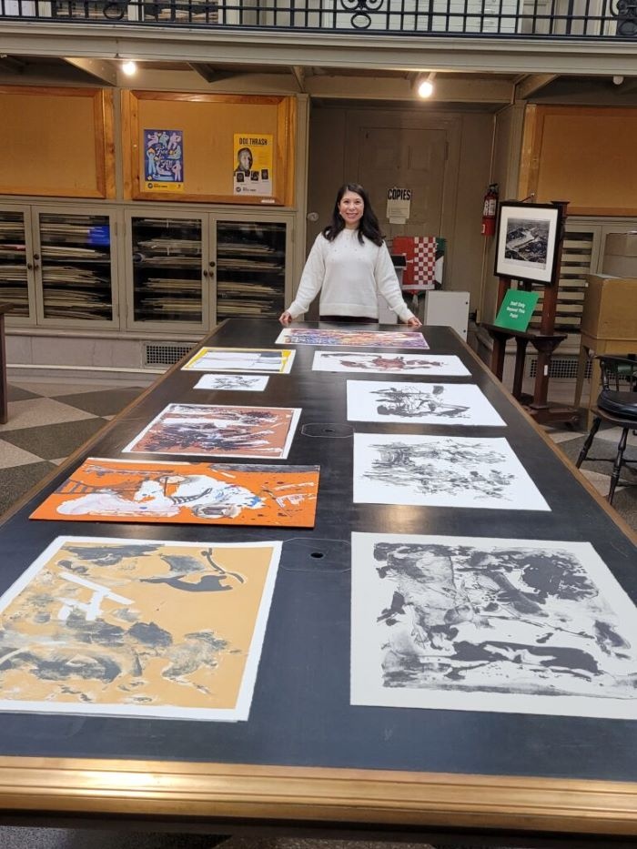 Romana Lee-Akiyama with a donation of prints by her father Chen Lok Lee
