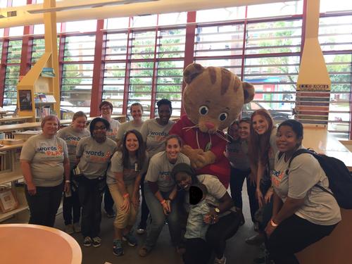 Daniel Tiger joins Words at Play staff and volunteers to celebrate a successful Block Party.