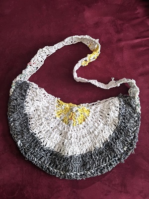 My first plarn project was Stitch and Hound’s Half-Moon Tote using the equivalent of about 70 plastic shopping bags. Pattern: https://stitchandhound.com/plarn-half-moon-tote/