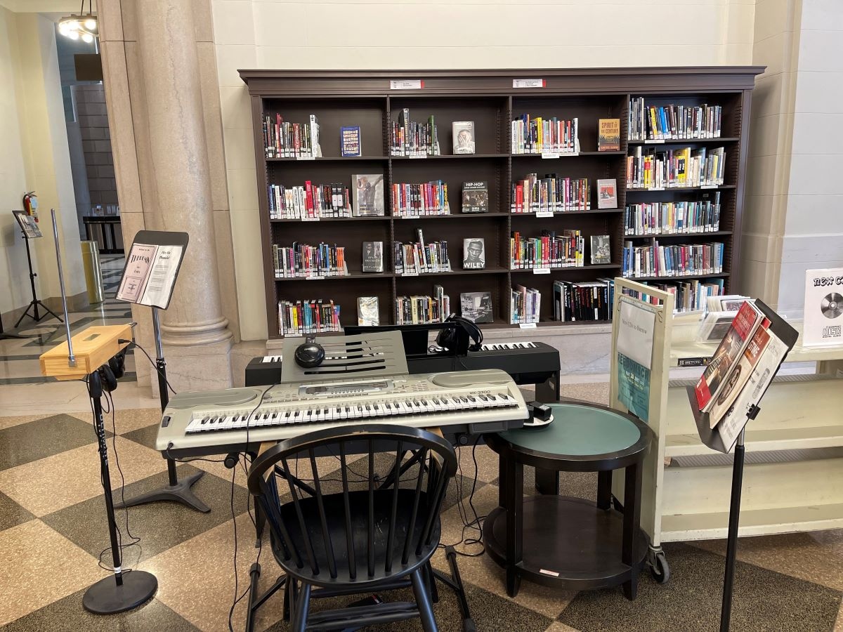 The Music Department's instruments for in-house use, with Hip Hop and New Books collections in the background