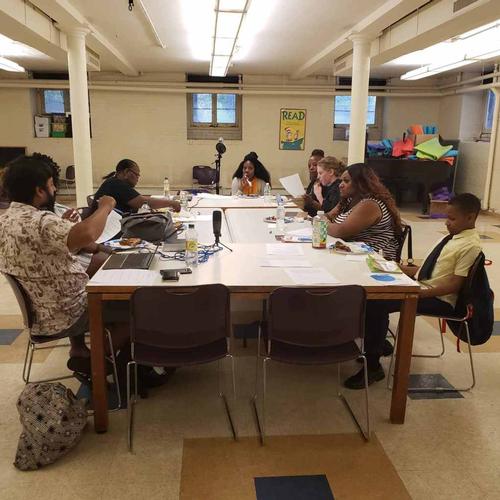 From left to right: Andrew Blassingame, Andrea Blassingame, Adrienne Harwell, Pat Erwin, Lapina Burris, Shirley Reynolds, Terica Green, and Neil Bardhan discuss ways to promote literacy in Southwest Philadelphia.