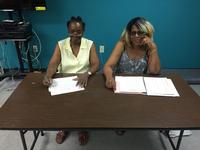 The Friends of Queen Memorial Library president, Betty Beaufort, along with Library Assistant Juanita Wilburn