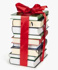 stack of books with a bow over them