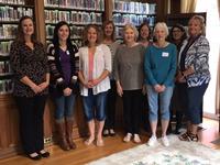 Jody Cole (center back), facilitator Eileen McGinley (left), and the Shippensburg staff 