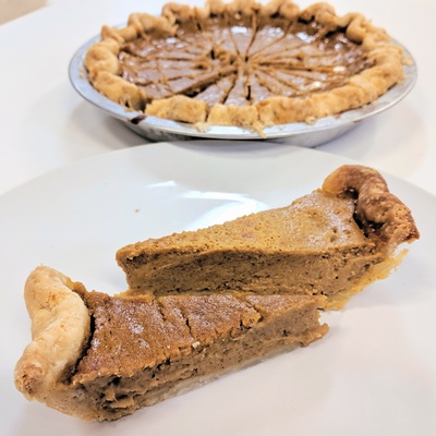 Pumpkin pie slices in a thick, shortbread-style crust
