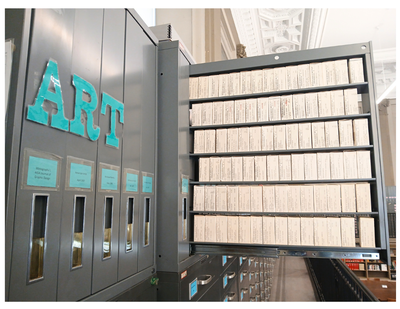 Microfilm reels in an open storage cabinet