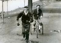 Burgess Meredith bikes to whip Sylvester Stallone into shape. Why don't you? (Image via Rides a Bike.)